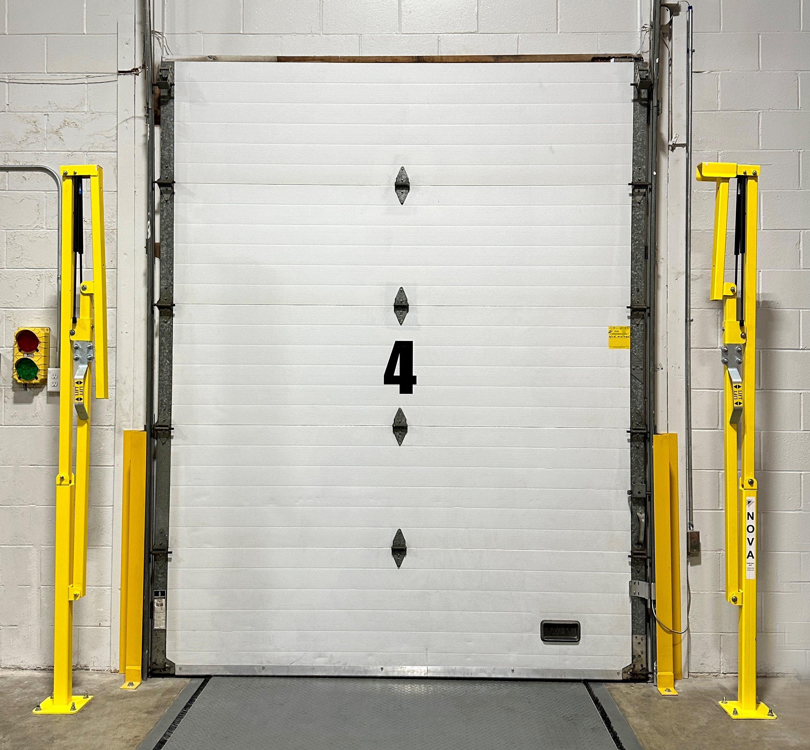 Loading dock with security gates raised